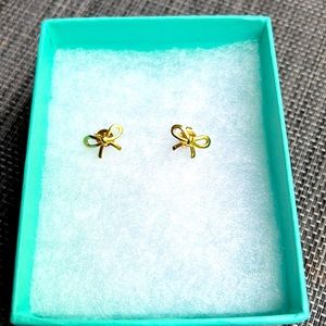 Authentic Tiffany gold bow ribbon 18K stud earrings.